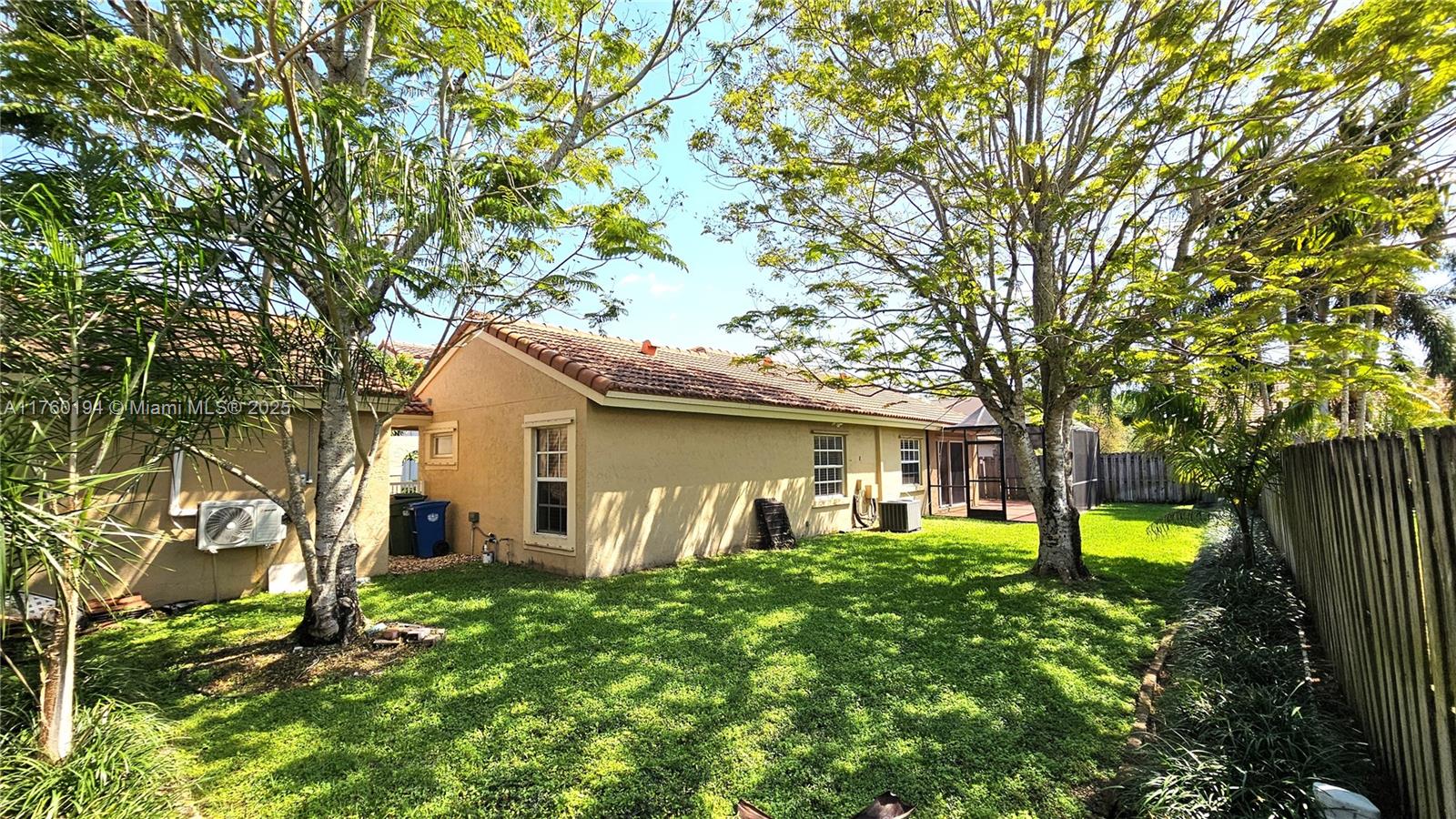 1350 Seagrape Circle Weston, FL 33326 - Photo 15 of 22 a front view of a house with a yard
