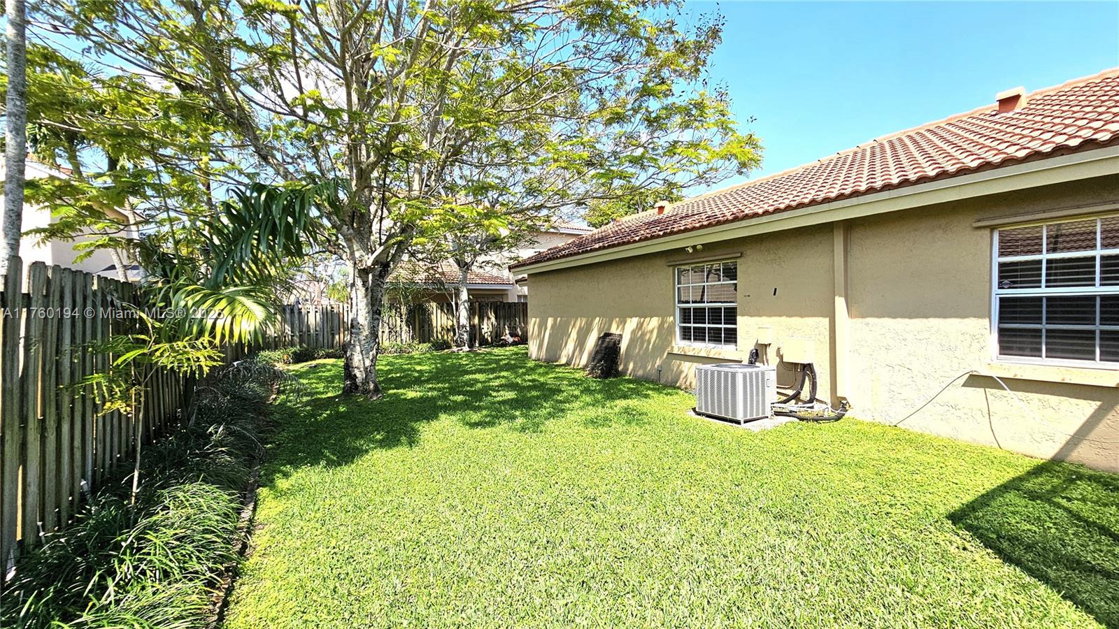 1350 Seagrape Circle Weston, FL 33326 - Photo 18 of 22 a view of a house with backyard