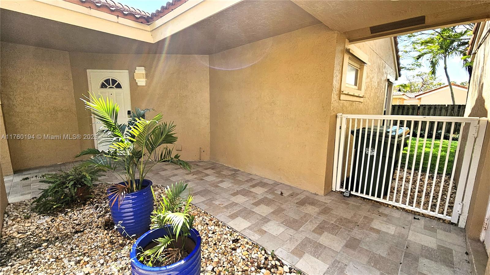 1350 Seagrape Circle Weston, FL 33326 - Photo 19 of 22 a vase of flowers sitting on a floor