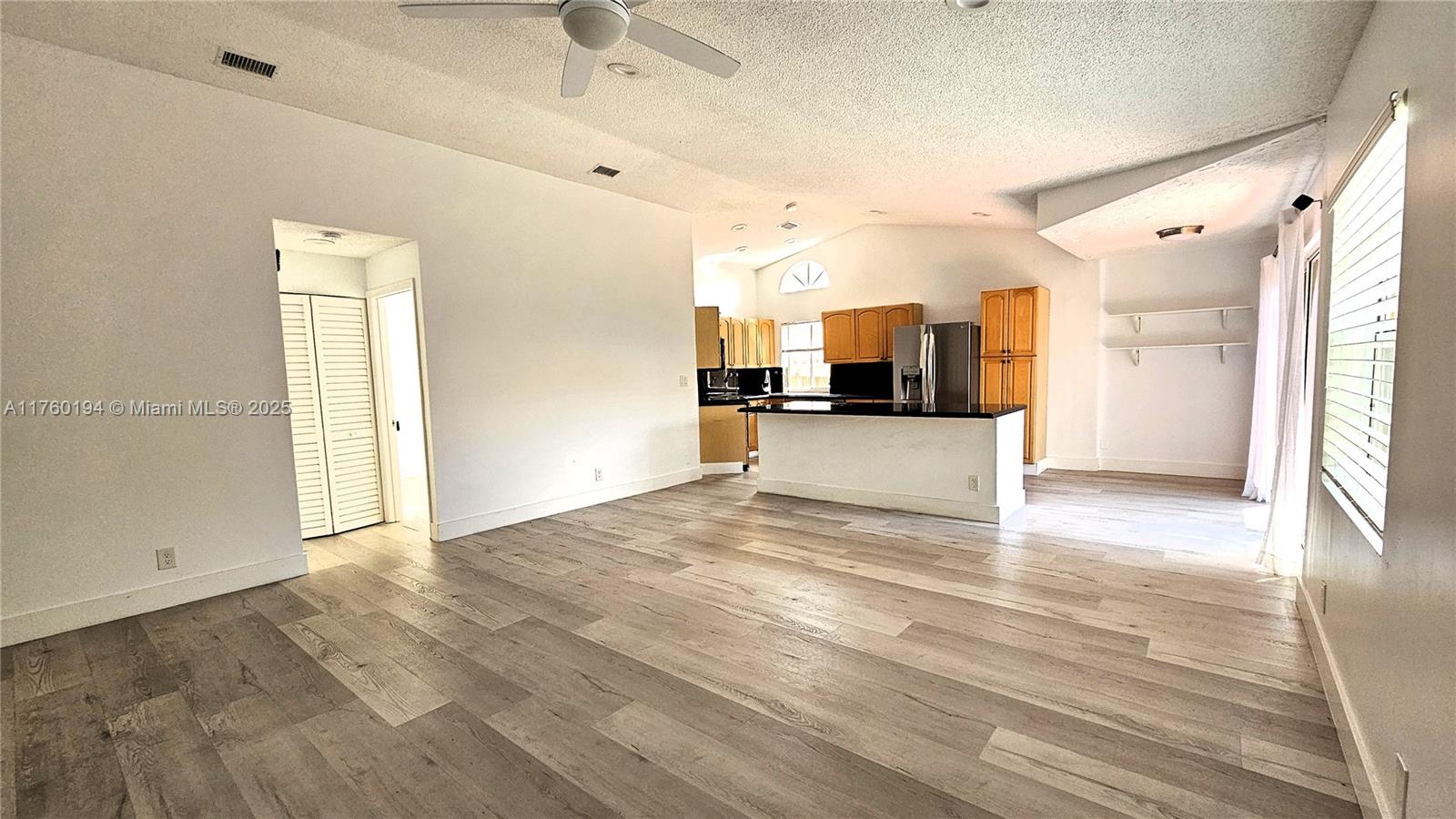 1350 Seagrape Circle Weston, FL 33326 - Photo 2 of 22 a view of a kitchen with a sink and a window