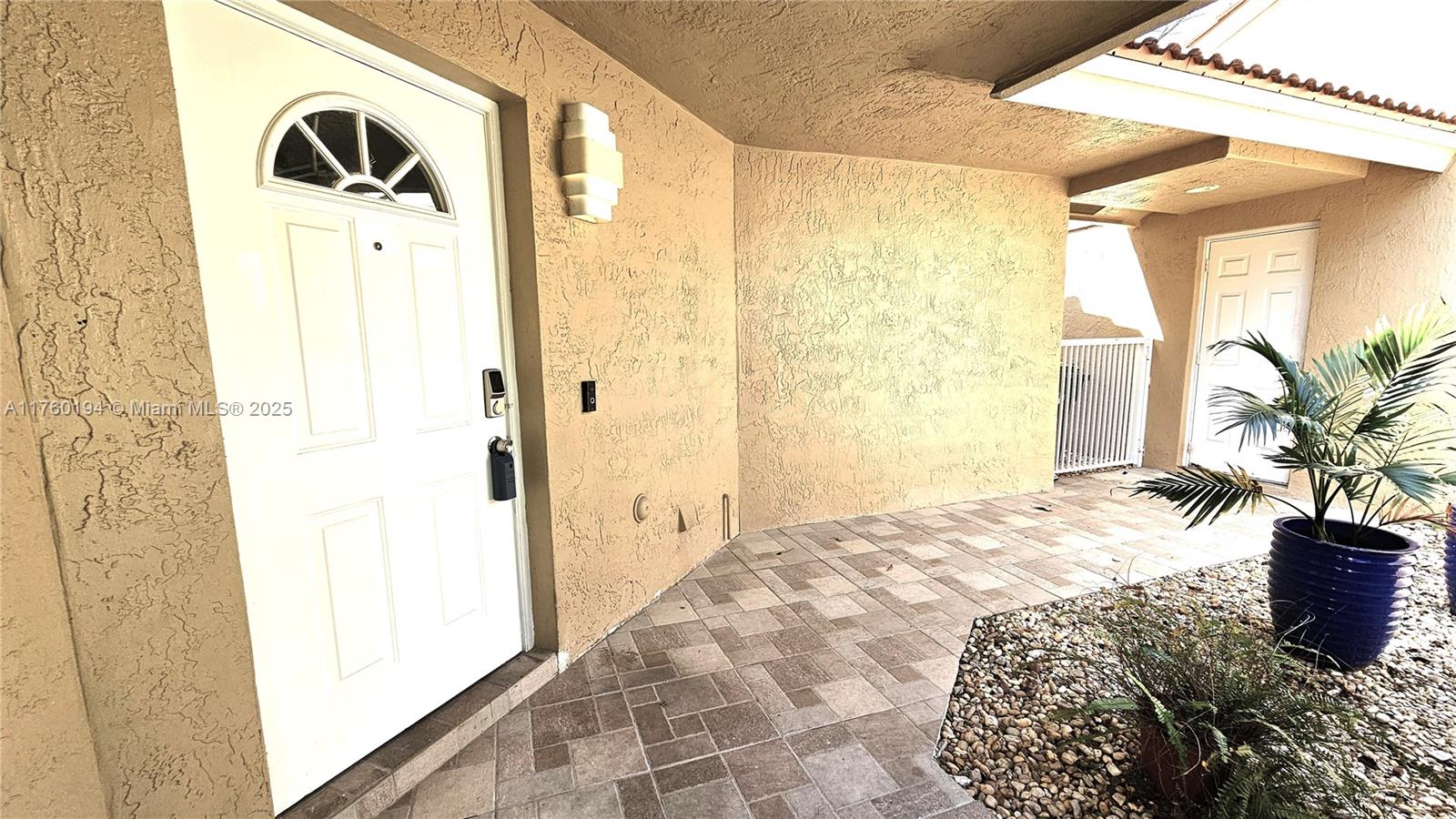 1350 Seagrape Circle Weston, FL 33326 - Photo 21 of 22 a bed room with a bed next to a window
