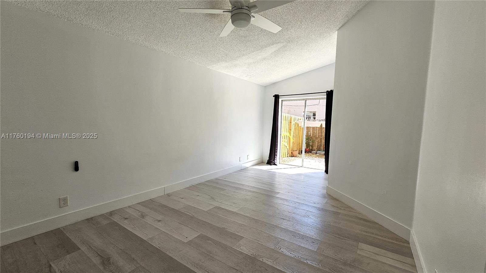 1350 Seagrape Circle Weston, FL 33326 - Photo 6 of 22 a view of an empty room with a window