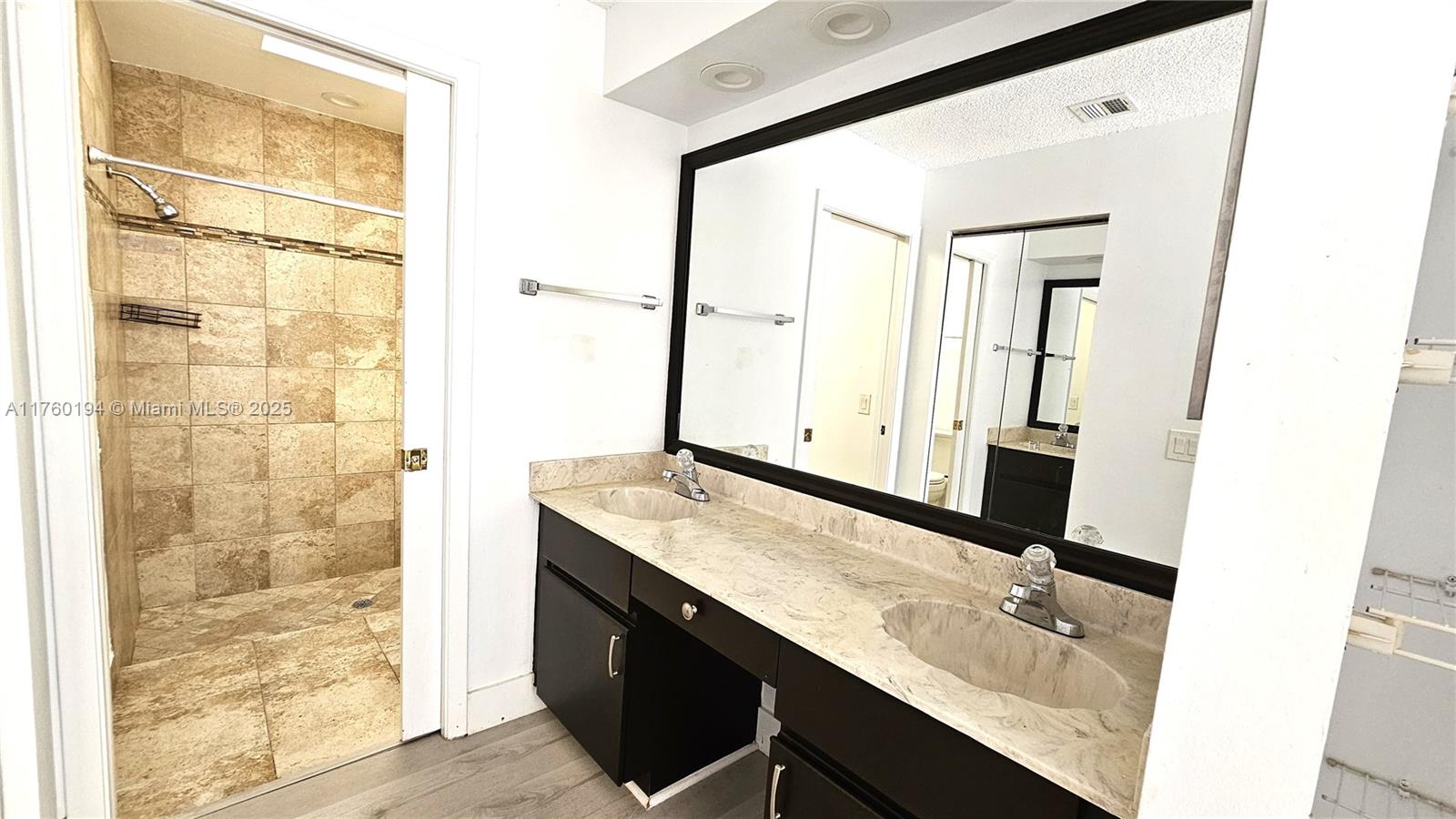 1350 Seagrape Circle Weston, FL 33326 - Photo 7 of 22 a bathroom with a granite countertop sink and a mirror