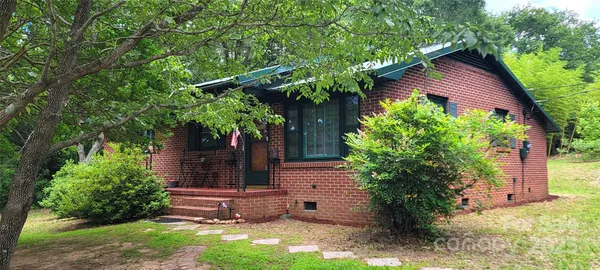 a view of a wooden door in the yard