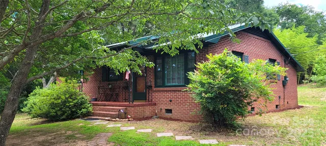 a view of a wooden door in the yard