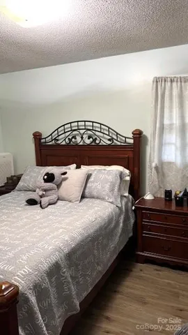 a view of a floor to ceiling window and wooden floor