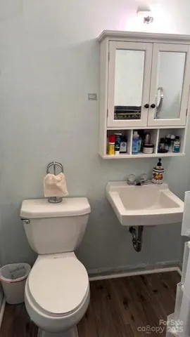 a living room with lots of furniture and a book shelf