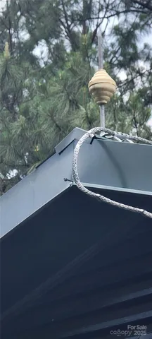 a view of a fireplace with two chairs in it