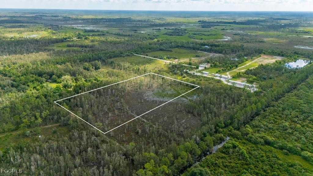 33715 Oil Well Road Punta Gorda, FL 33955 - Photo 7 of 15 a view of a field with an ocean