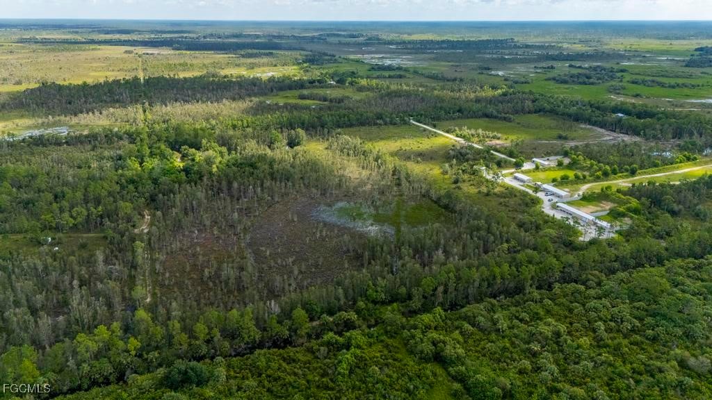 33715 Oil Well Road Punta Gorda, FL 33955 - Photo 10 of 15 a view of a lake with a mountain