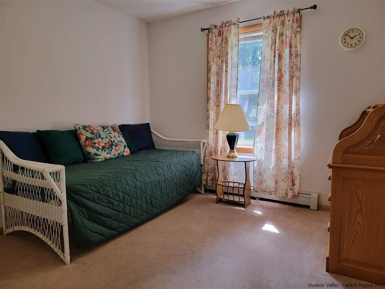 634 Vernal Butler Road Cairo, NY 12413 - Photo 12 of 22 a bedroom with a bed and a window
