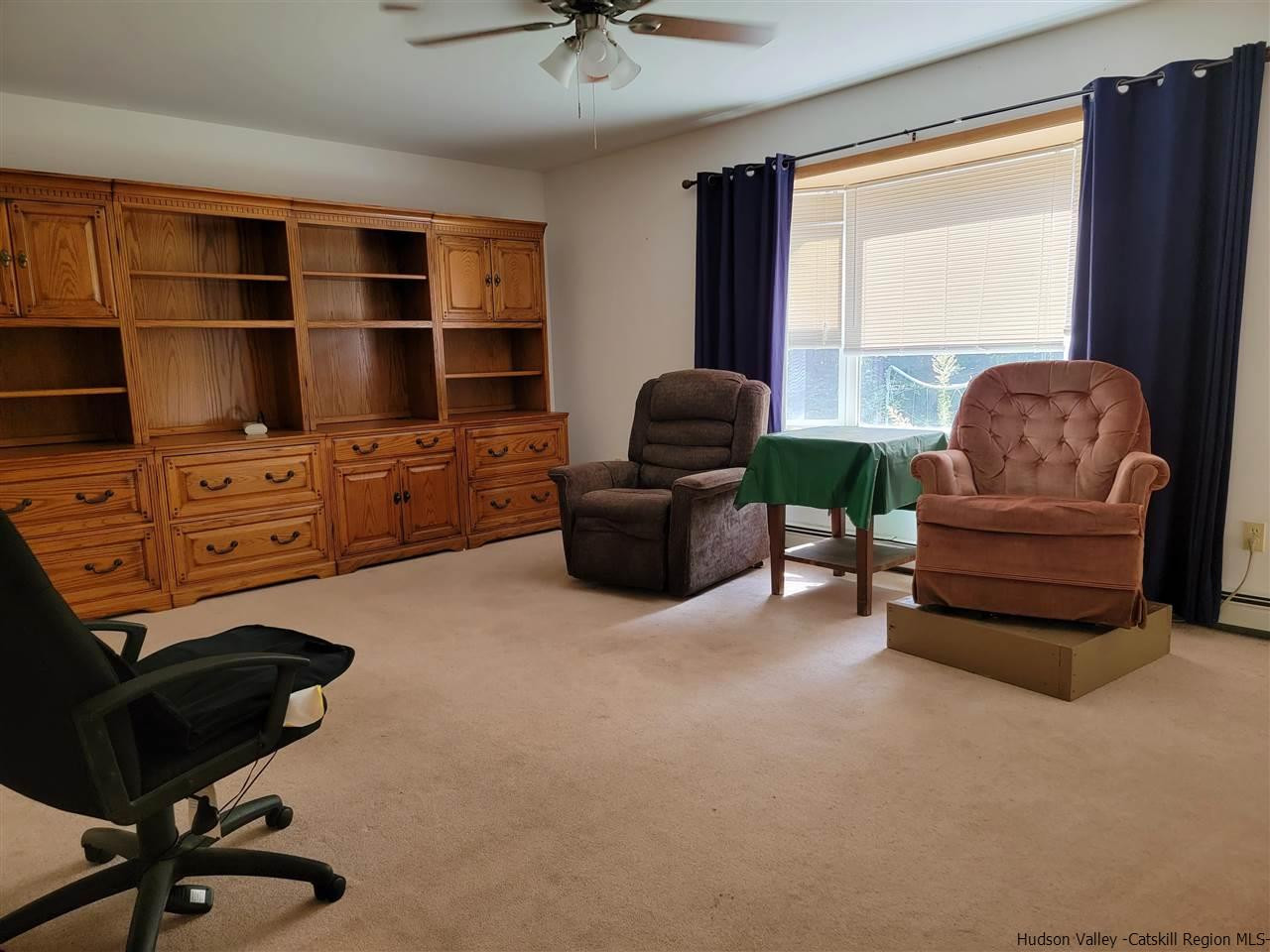 634 Vernal Butler Road Cairo, NY 12413 - Photo 3 of 22 a living room with furniture and a flat screen tv