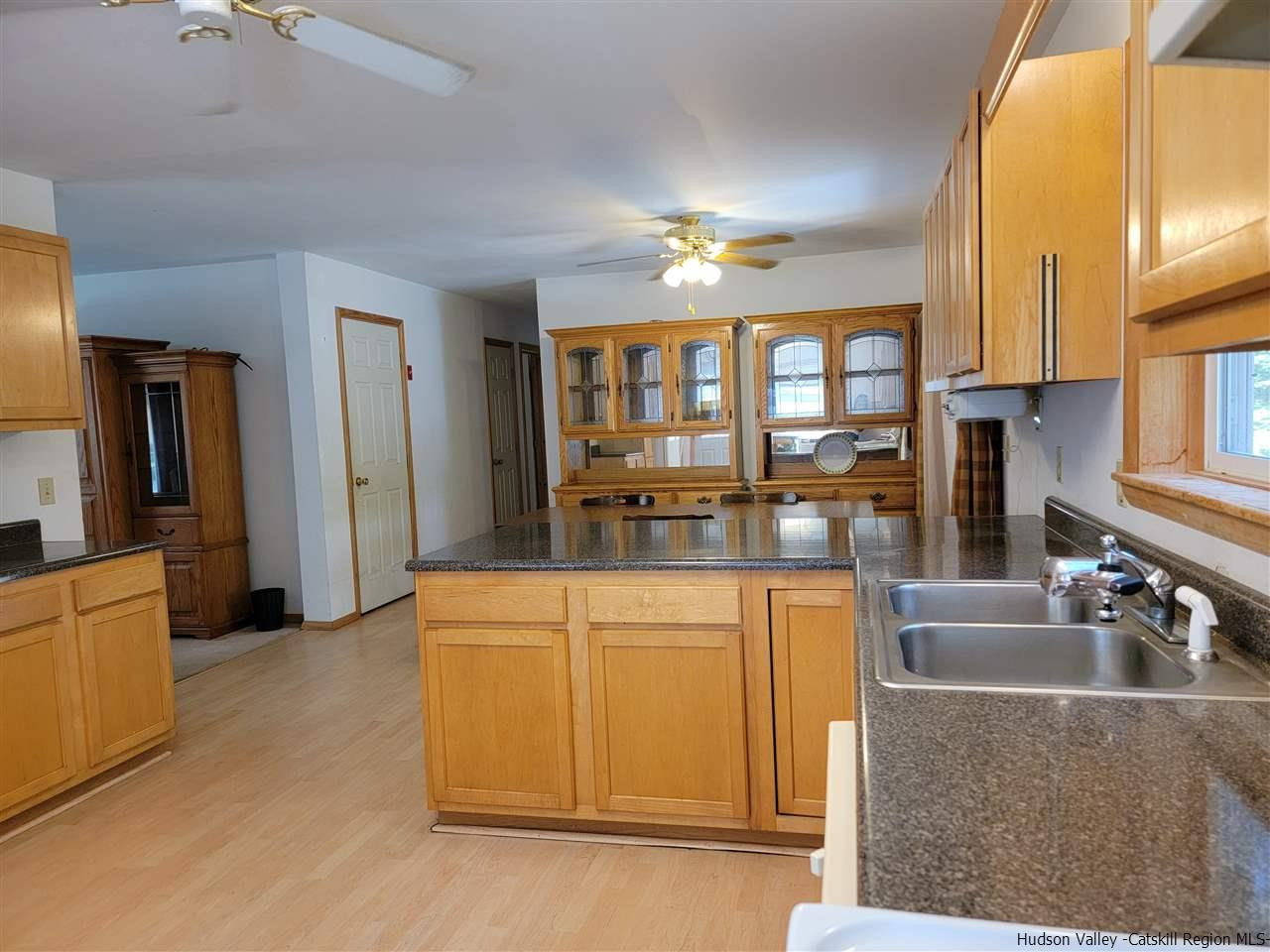 634 Vernal Butler Road Cairo, NY 12413 - Photo 5 of 22 a kitchen with stainless steel appliances granite countertop a stove a sink and a refrigerator