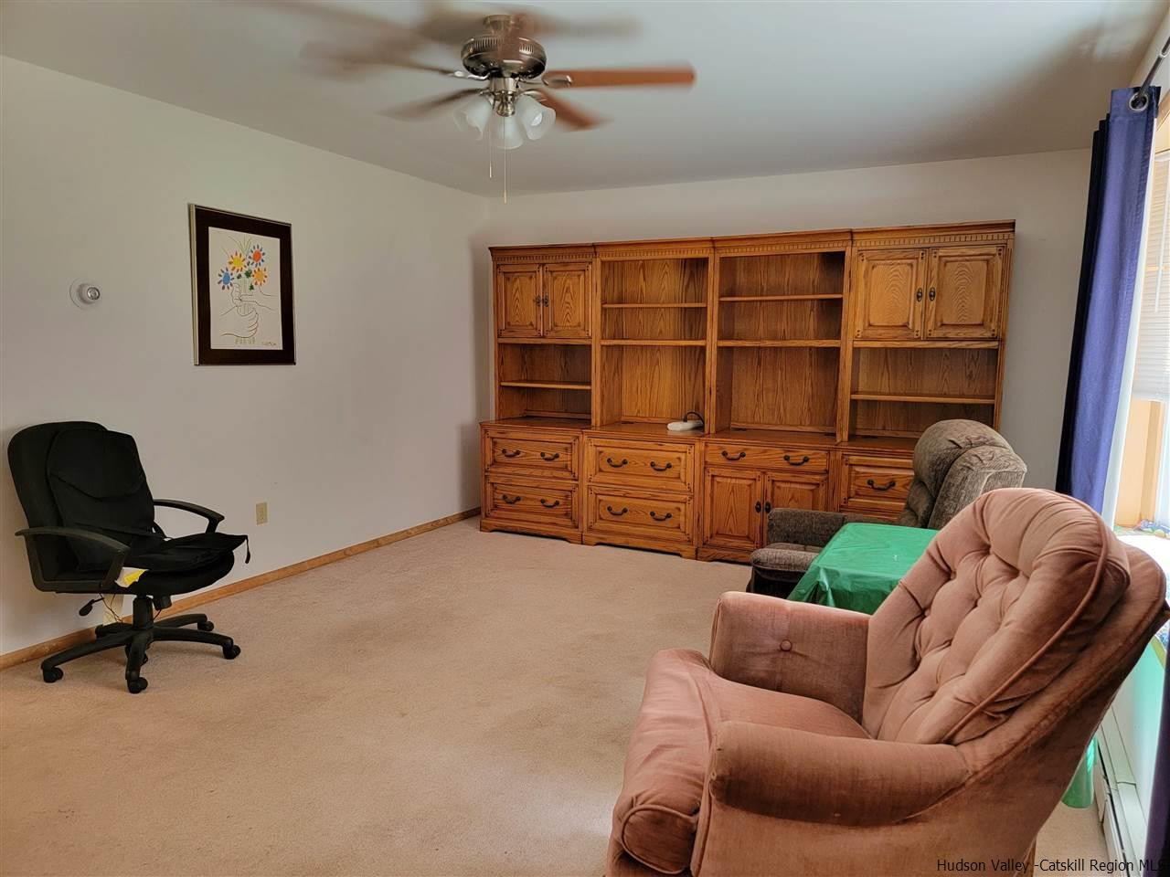 634 Vernal Butler Road Cairo, NY 12413 - Photo 9 of 22 a view of a livingroom with workspace and a couch