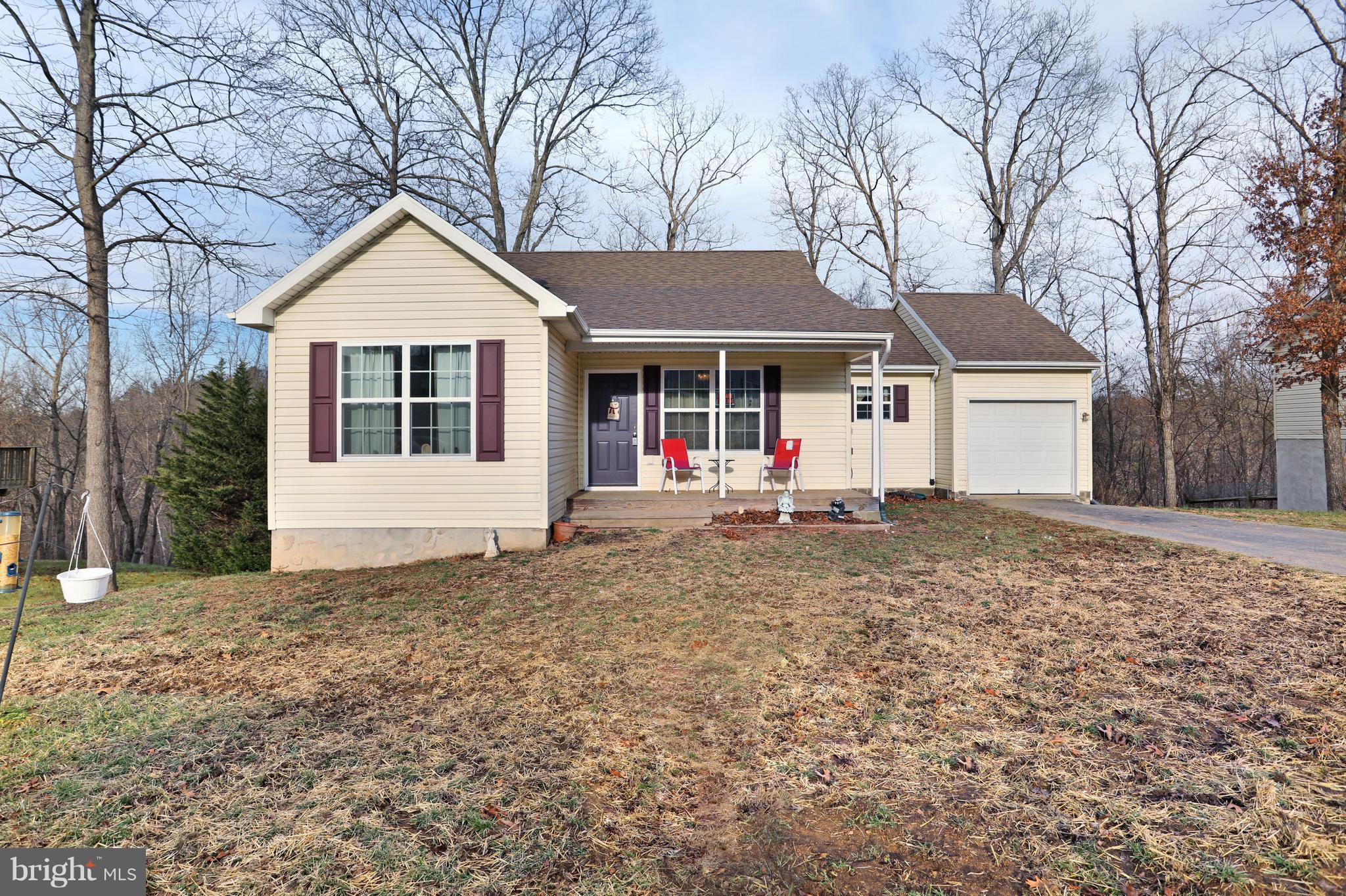 140 Raft Court Inwood, WV 25428 - Photo 1 of 34 a front view of a house with a yard