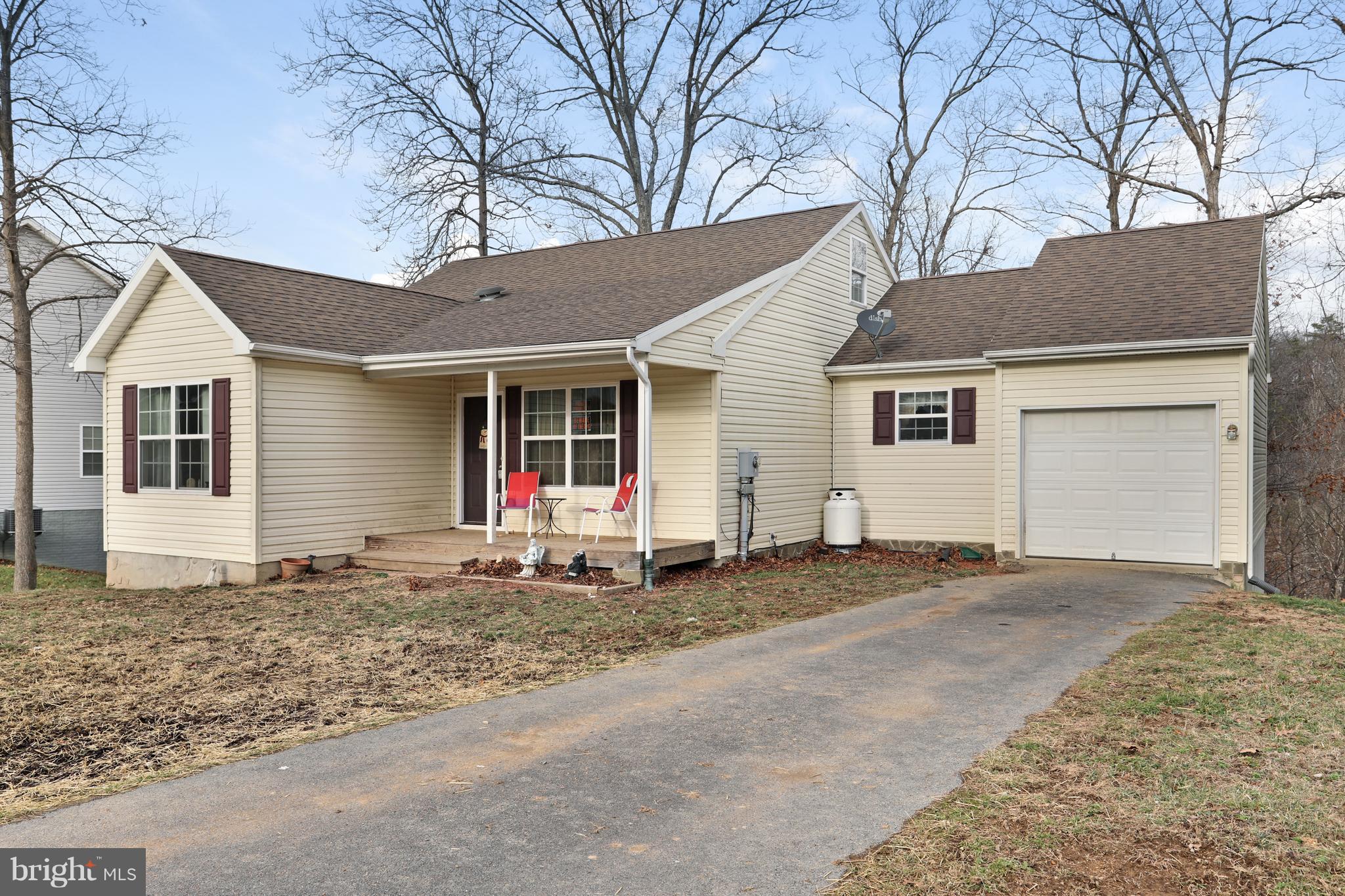 140 Raft Court Inwood, WV 25428 - Photo 3 of 34 a view of a house with a patio