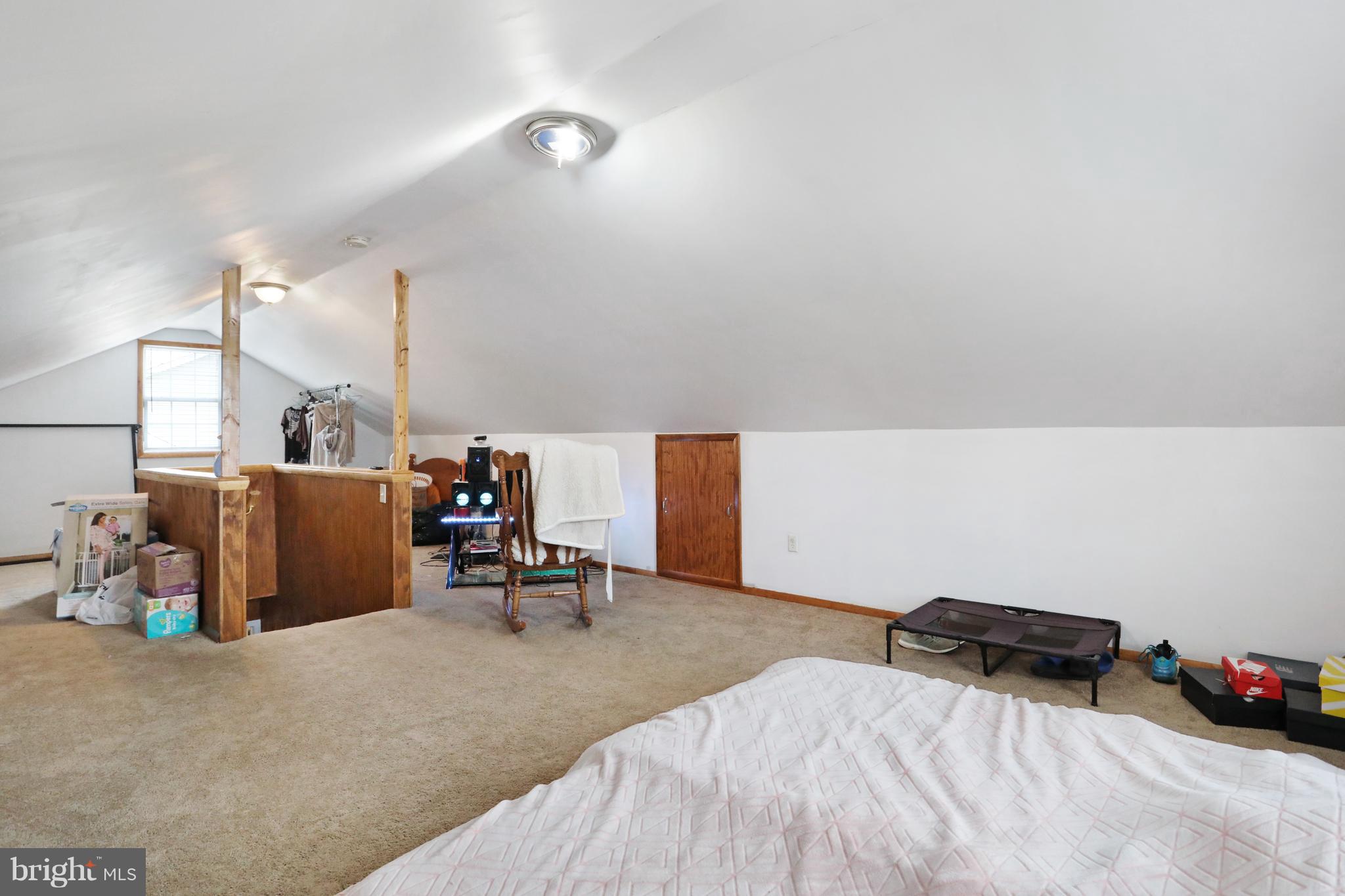 140 Raft Court Inwood, WV 25428 - Photo 25 of 34 a bedroom with furniture and a chandelier