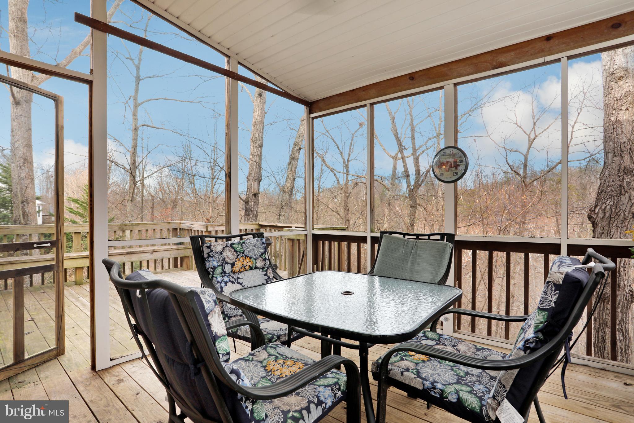 140 Raft Court Inwood, WV 25428 - Photo 28 of 34 a view of a chairs and table in the balcony