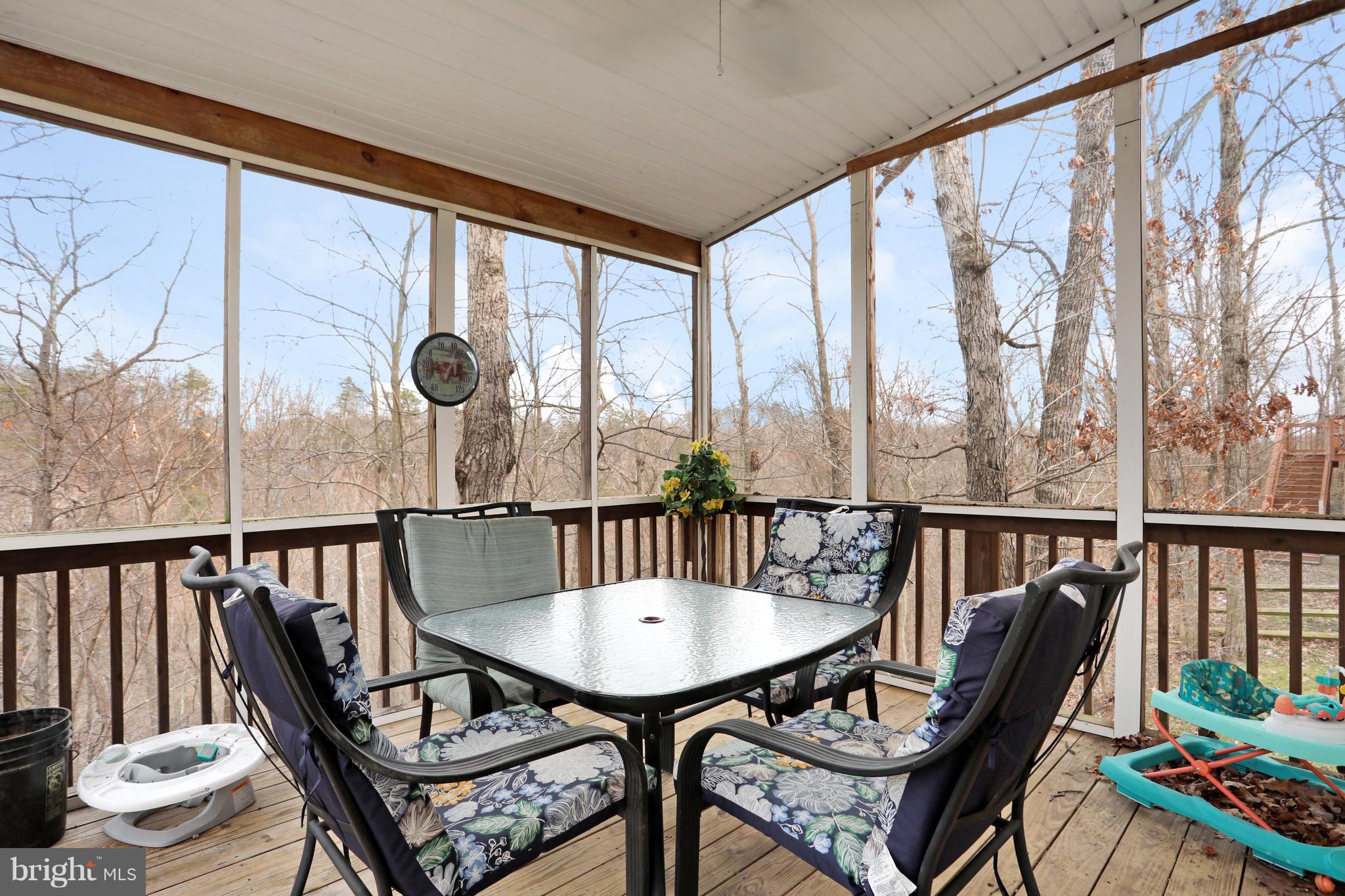 140 Raft Court Inwood, WV 25428 - Photo 29 of 34 a view of a balcony with furniture and wooden floor