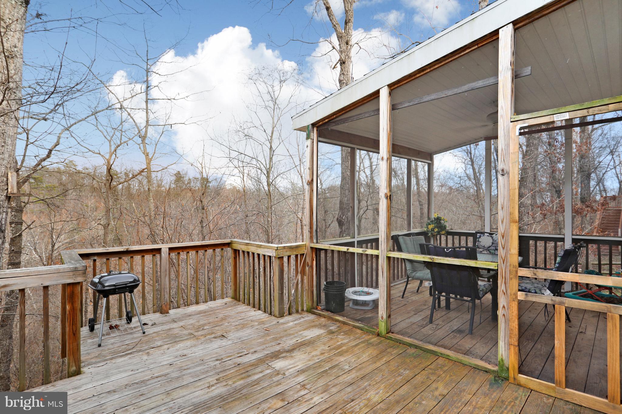 140 Raft Court Inwood, WV 25428 - Photo 30 of 34 a view of a balcony with chairs and wooden floor