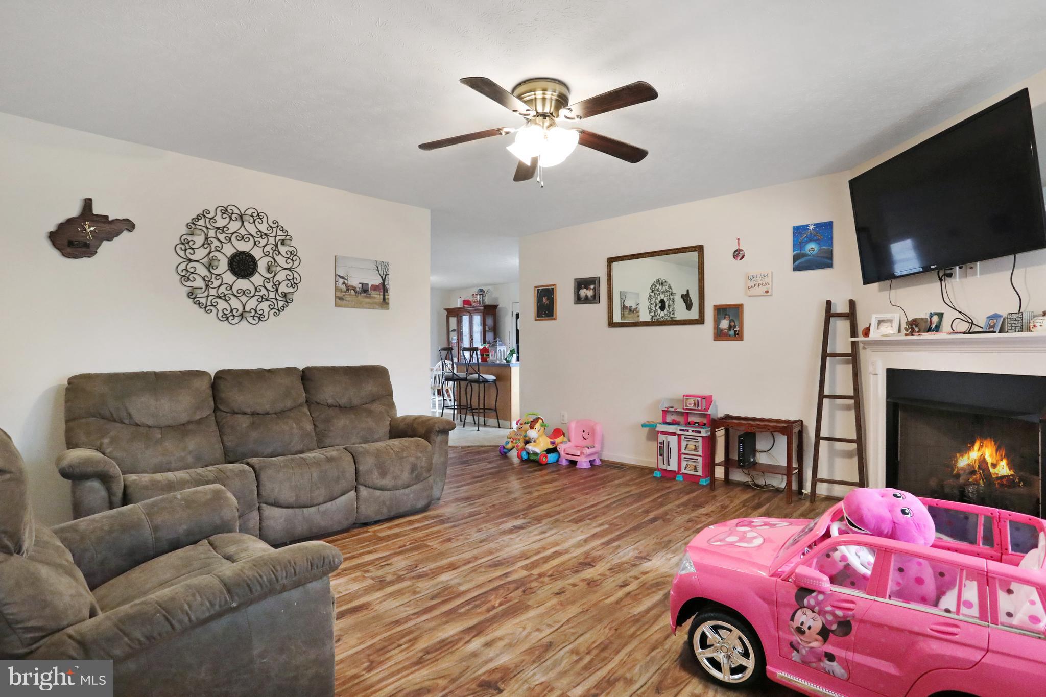140 Raft Court Inwood, WV 25428 - Photo 4 of 34 a living room with furniture and a flat screen tv