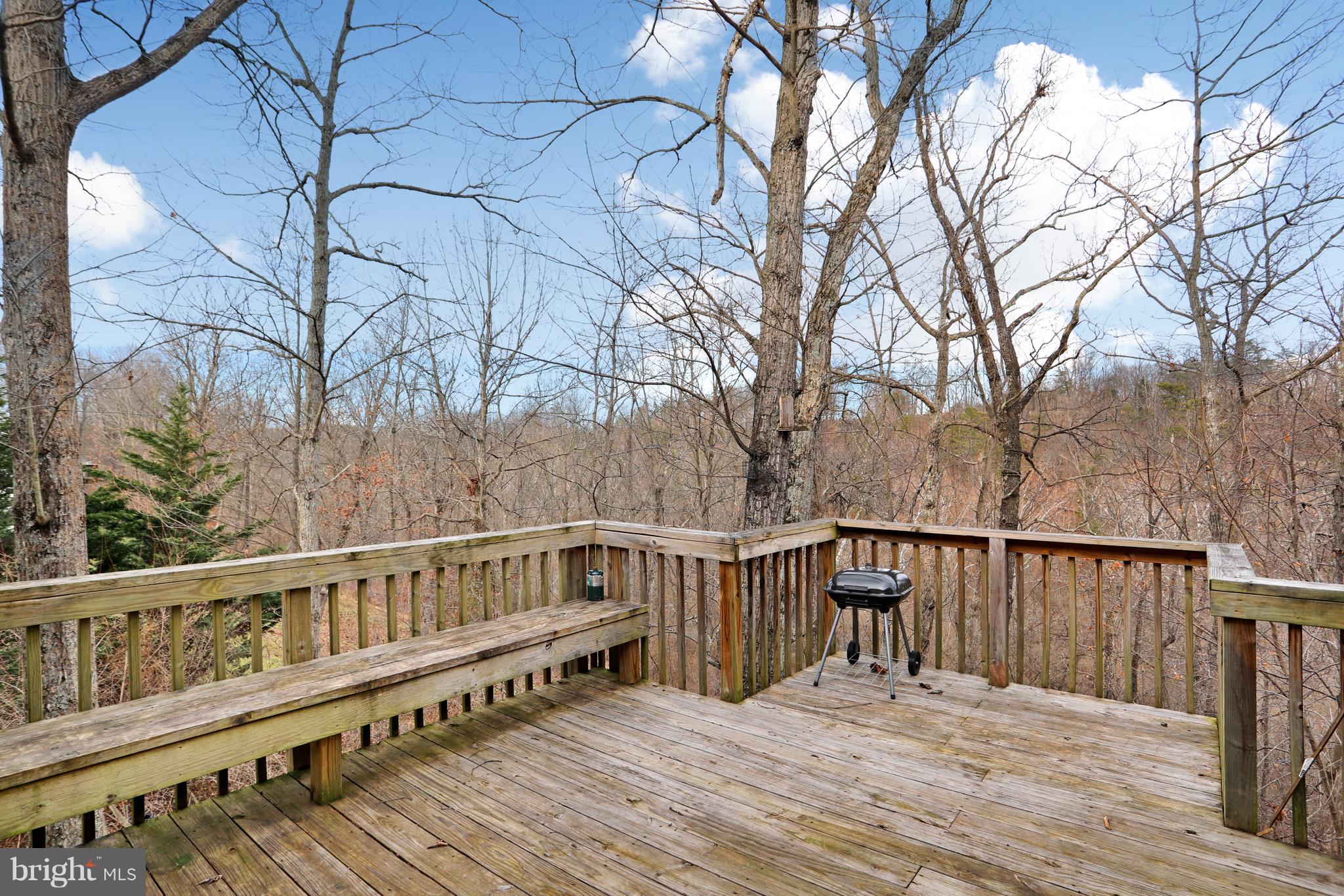 140 Raft Court Inwood, WV 25428 - Photo 31 of 34 a view of wooden deck and a backyard