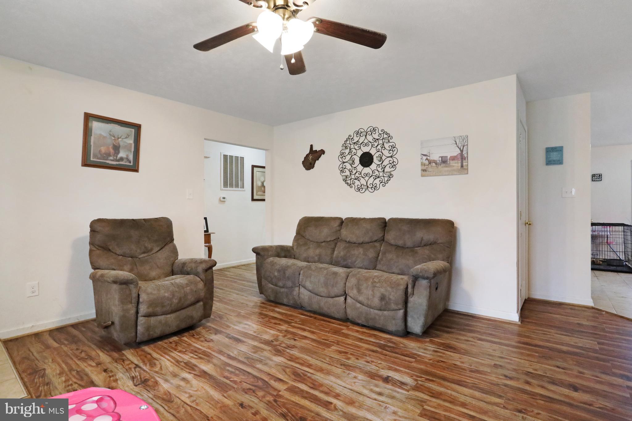 140 Raft Court Inwood, WV 25428 - Photo 7 of 34 a living room with couches and a coffee table