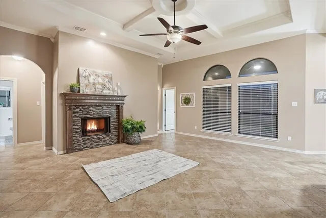 a view of a livingroom with a fireplace and window