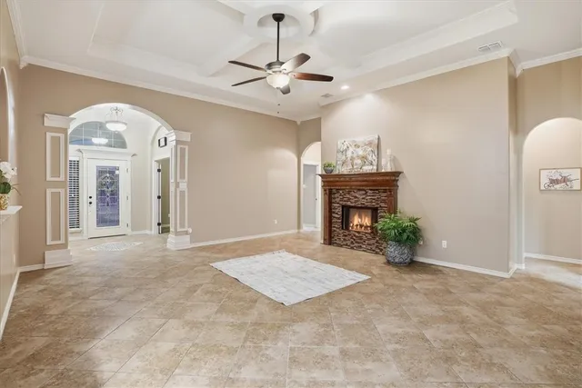 a view of an empty room and a fireplace