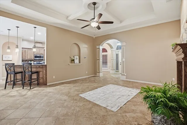 a view of a hallway with entryway and chandelier
