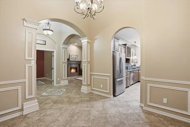 a view of a hallway with entryway dining table and chairs