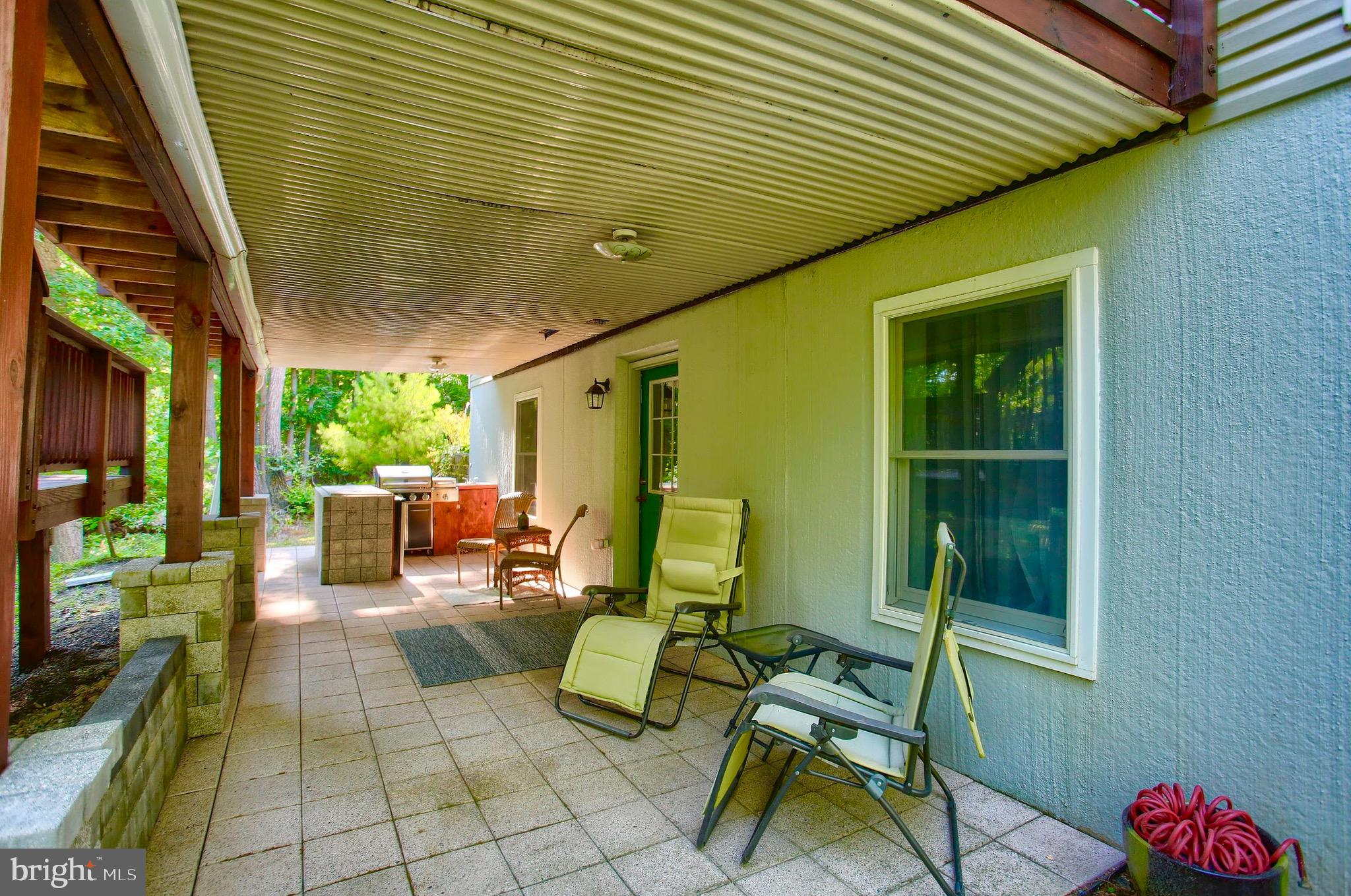 136 Chain Saw Road Dillsburg, PA 17019 - Photo 40 of 54 Covered Porch With Cooking Area