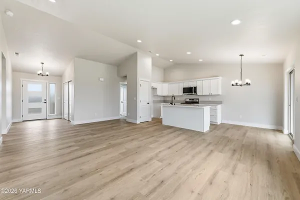 a view of kitchen with wooden floor and window