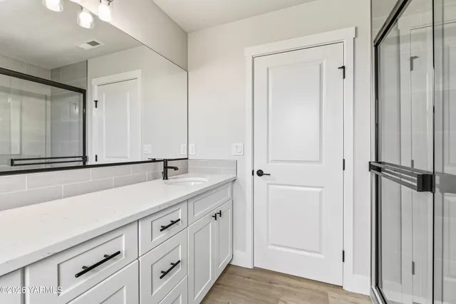 a bathroom with a sink and a mirror