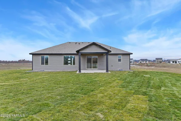 a view of a yard in front of a house with a yard