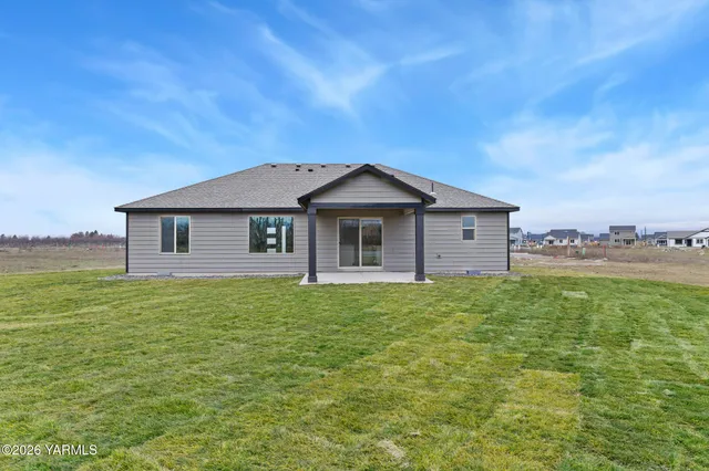 a view of a yard in front of a house with a yard