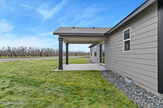 a view of a garden with an outdoor seating and deck