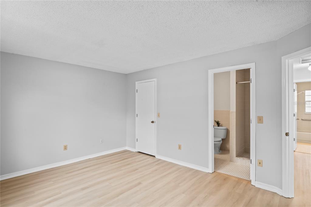 6028 Wilds Drive, Unit 6A New Port Richey, FL 34653 - Photo 13 of 40 wooden floor in an empty room