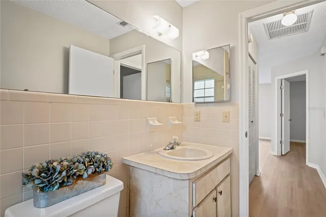 a bathroom with a sink and mirror
