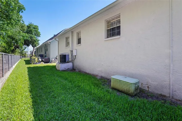 a view of a backyard with plants and a backyard