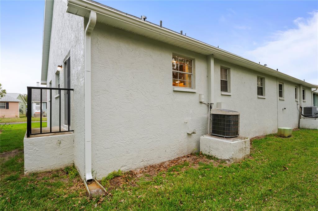 6028 Wilds Drive, Unit 6A New Port Richey, FL 34653 - Photo 38 of 40 a view of a house with backyard and garden