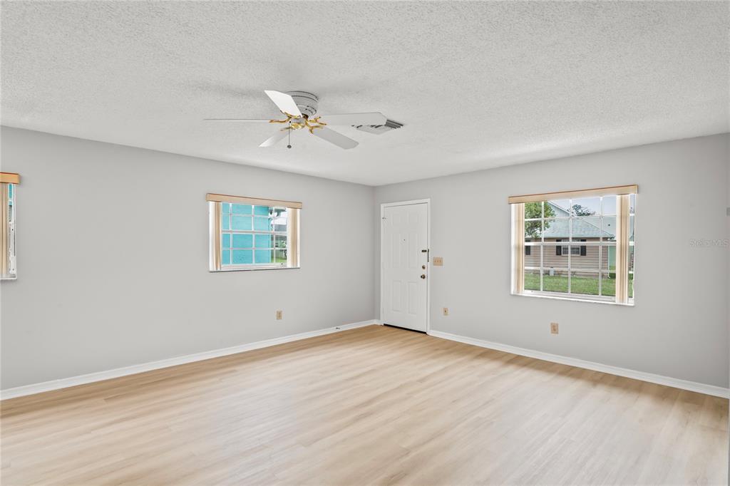 6028 Wilds Drive, Unit 6A New Port Richey, FL 34653 - Photo 7 of 40 a view of an empty room with a window