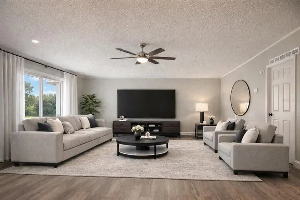 a living room with furniture and a flat screen tv