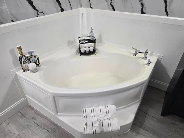 a white bath tub sitting in a bathroom