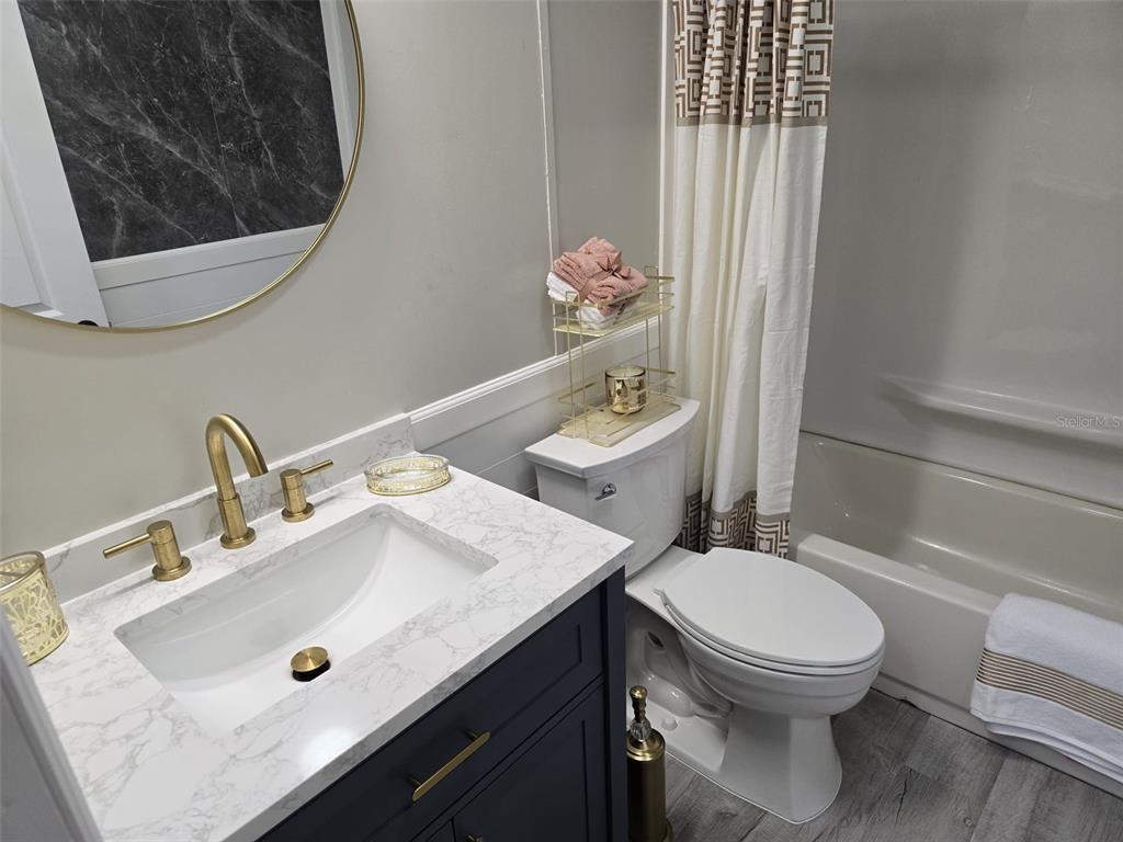 3700 West Highway 316 Reddick, FL 32686 - Photo 30 of 39 a bathroom with a sink a toilet and shower