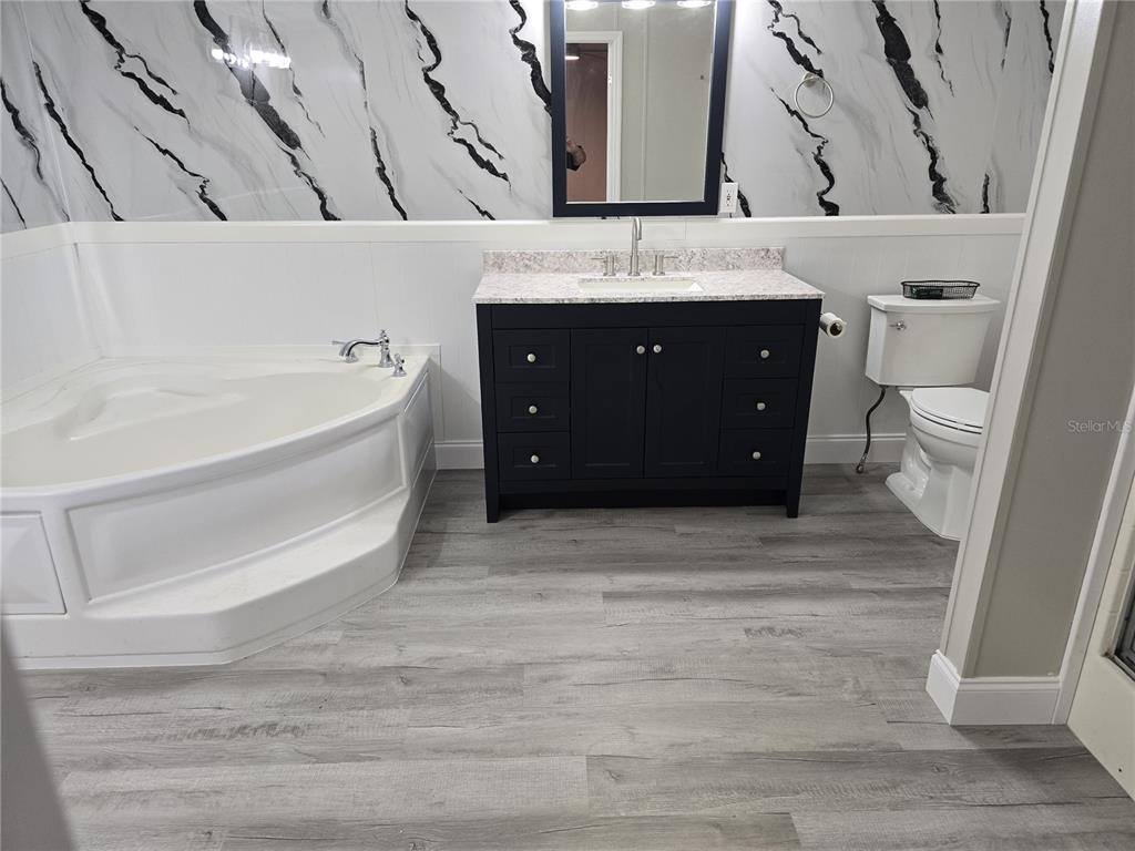 3700 West Highway 316 Reddick, FL 32686 - Photo 32 of 39 a bathroom with a sink and a bathtub