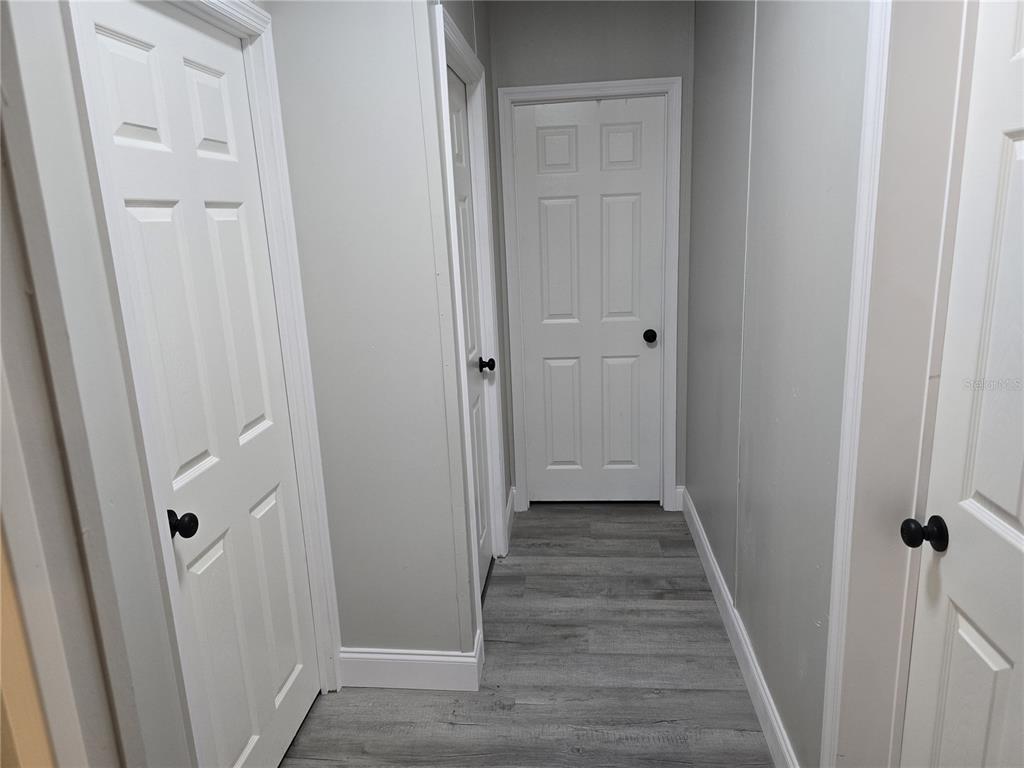 3700 West Highway 316 Reddick, FL 32686 - Photo 37 of 39 a view of a hallway with wooden floor and staircase
