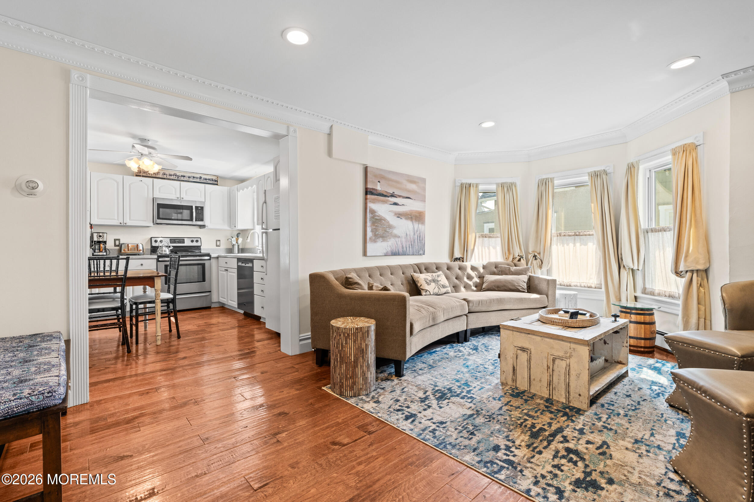 75 Webb Avenue, Unit UPPER WEEKLY Ocean Grove, NJ 07756 - Photo 11 of 41 a living room with furniture and a table