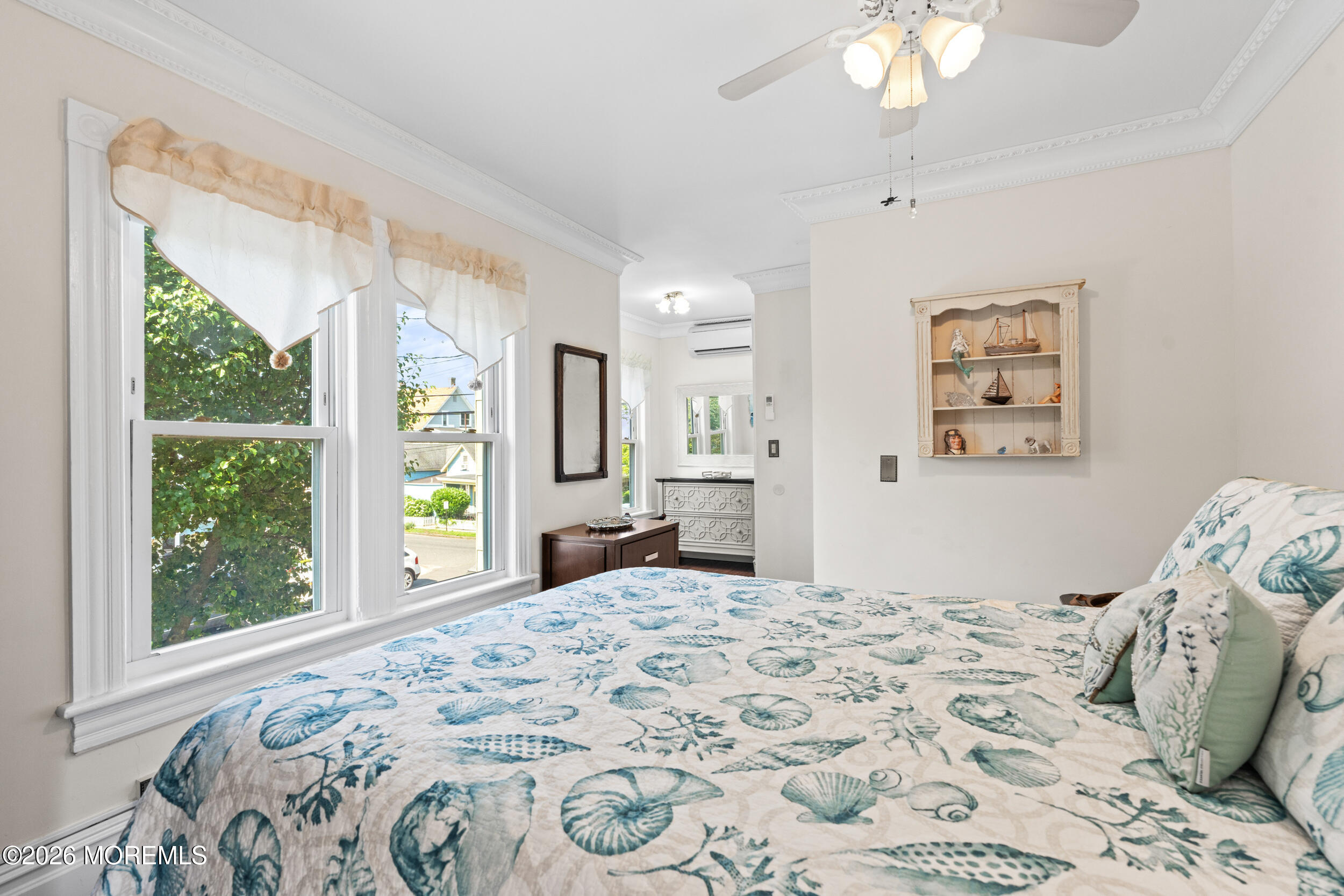 75 Webb Avenue, Unit UPPER WEEKLY Ocean Grove, NJ 07756 - Photo 20 of 41 a bedroom with a large bed and a window