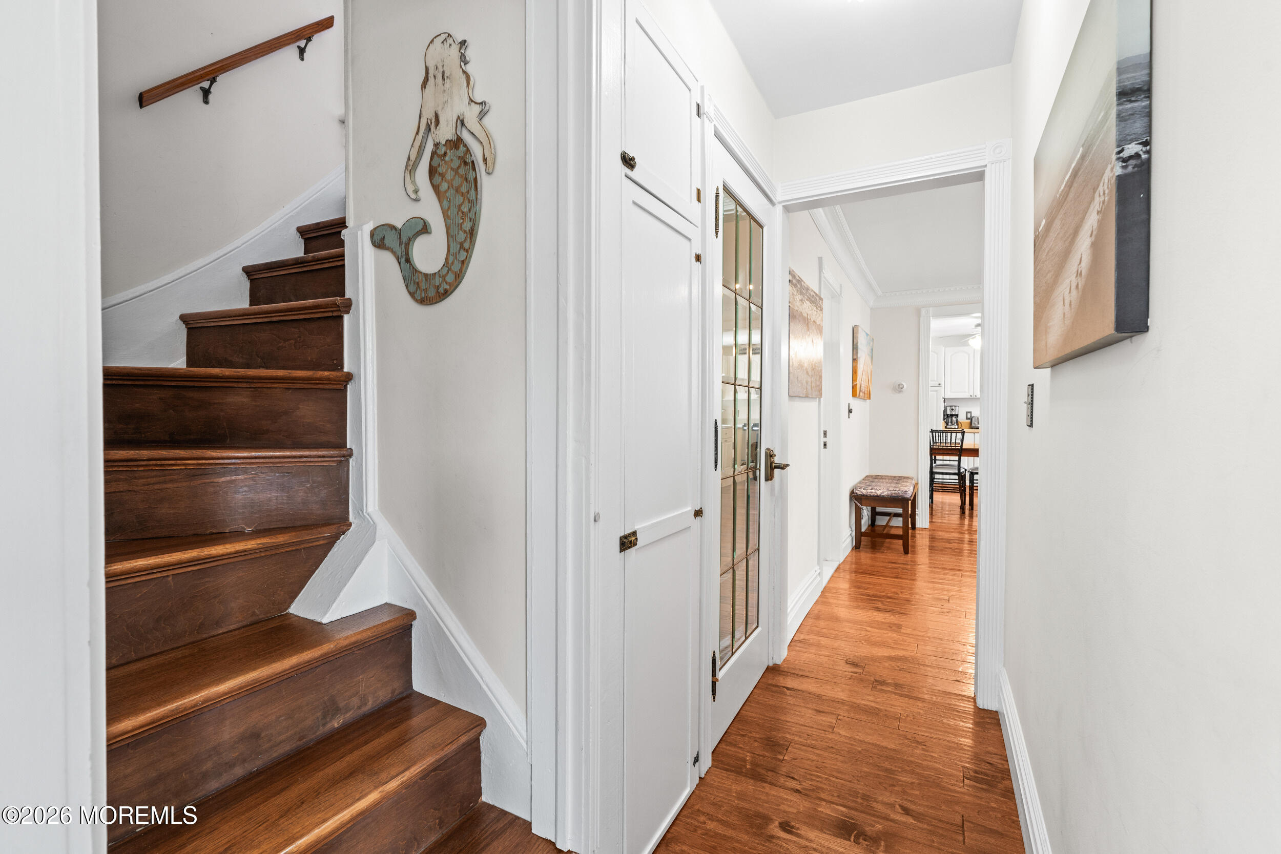 75 Webb Avenue, Unit UPPER WEEKLY Ocean Grove, NJ 07756 - Photo 22 of 41 a view of hallway with stairs and a chandelier